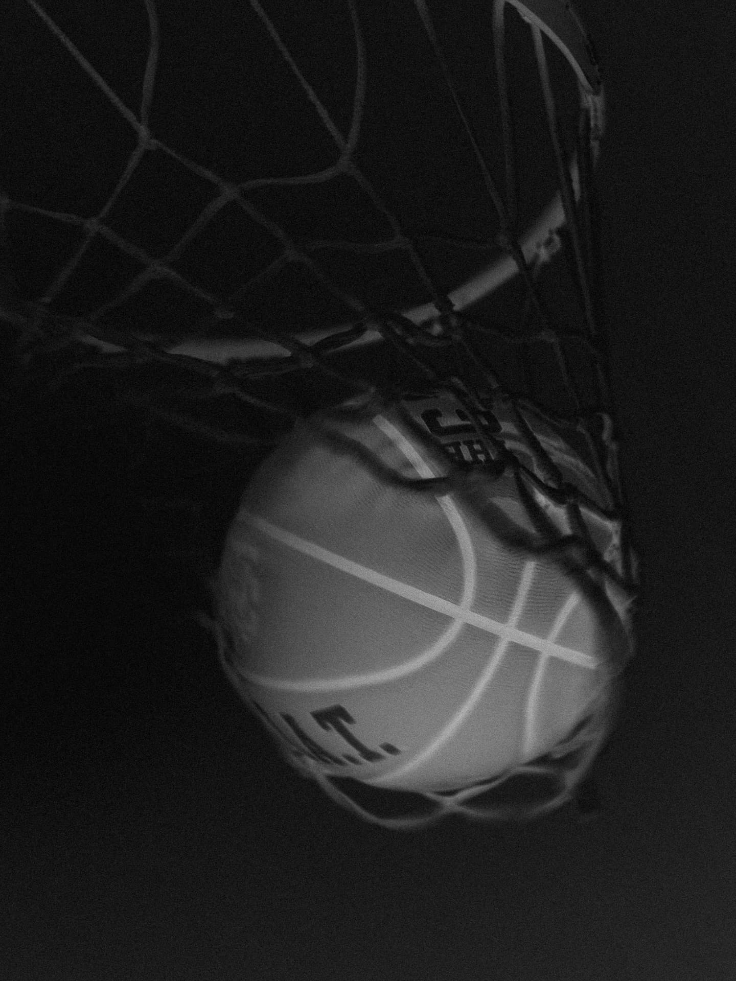 Basketball player in quiet gym moment